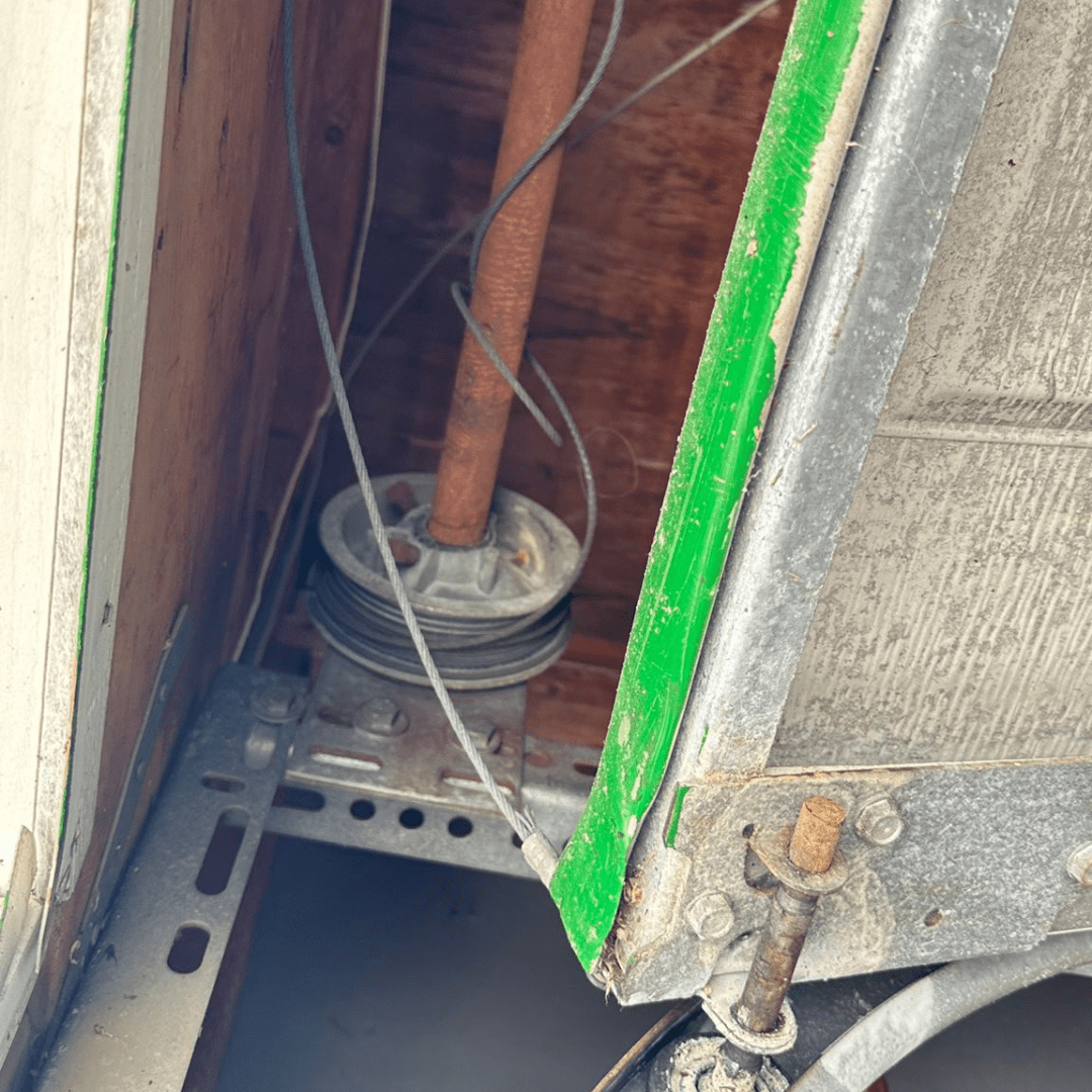 up close view of garage door cable repair